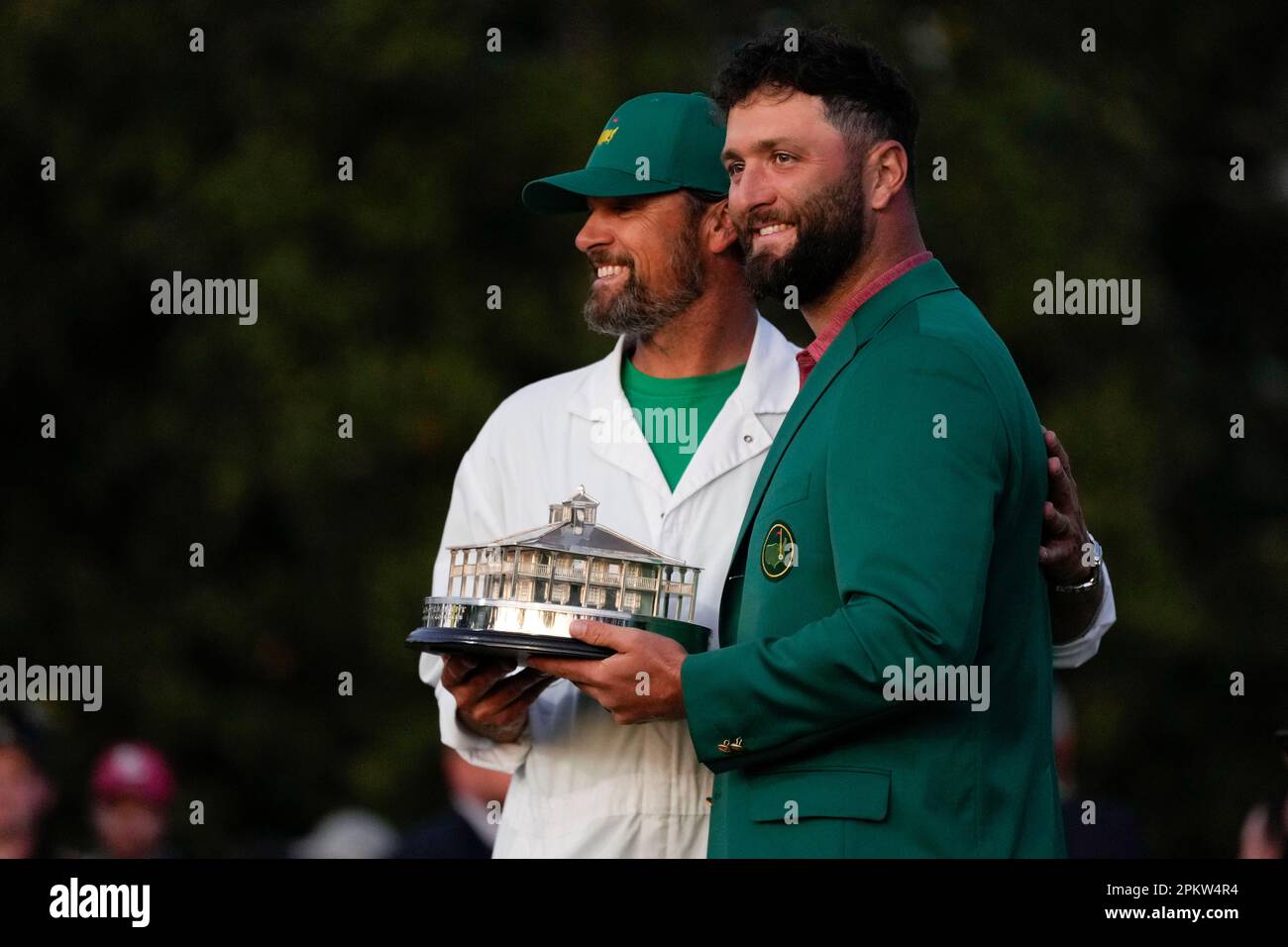 Jon Rahm, of Spain, poses for a photo with his caddie Adam Hayes