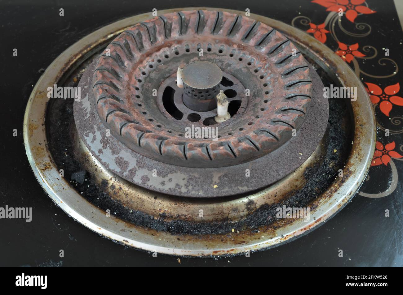 Close up view of grunge stove pan with fat stains, fry spots, oil splatters and burned-on bits Stock Photo