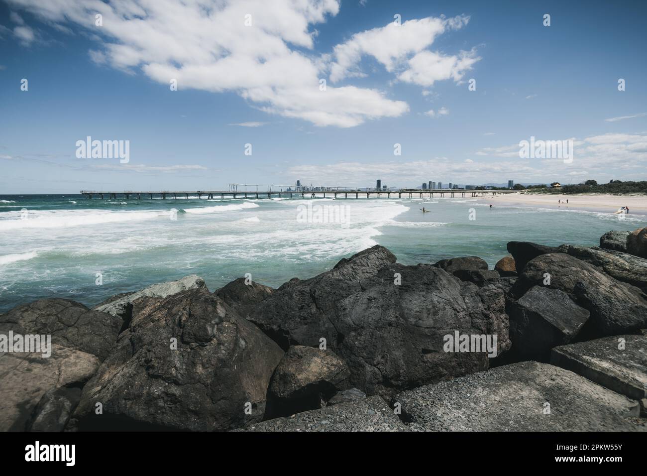 The Spit, Gold Coast, Queensland, Australia. View from the seaway, over the rocks towards the jetty. Stock Photo