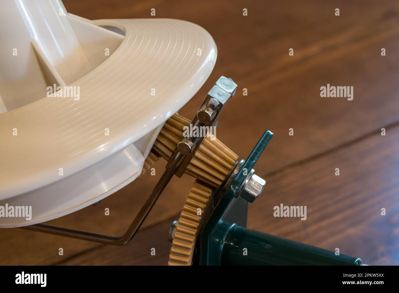 Mechanical yarn winder or reel used in knitting. Closeup, of the gear
