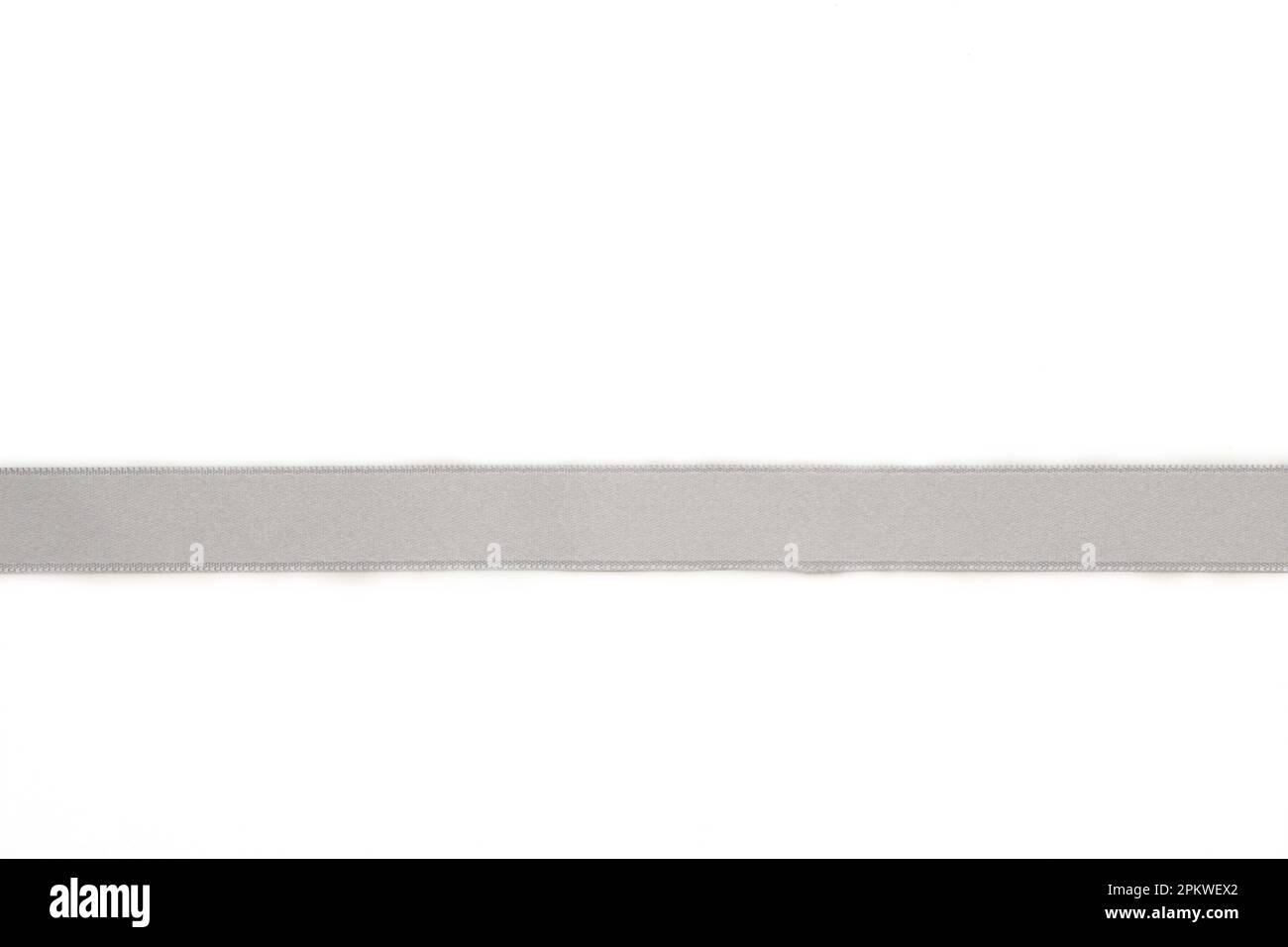 Shiny silver satin ribbon on white background. Top view Stock Photo - Alamy