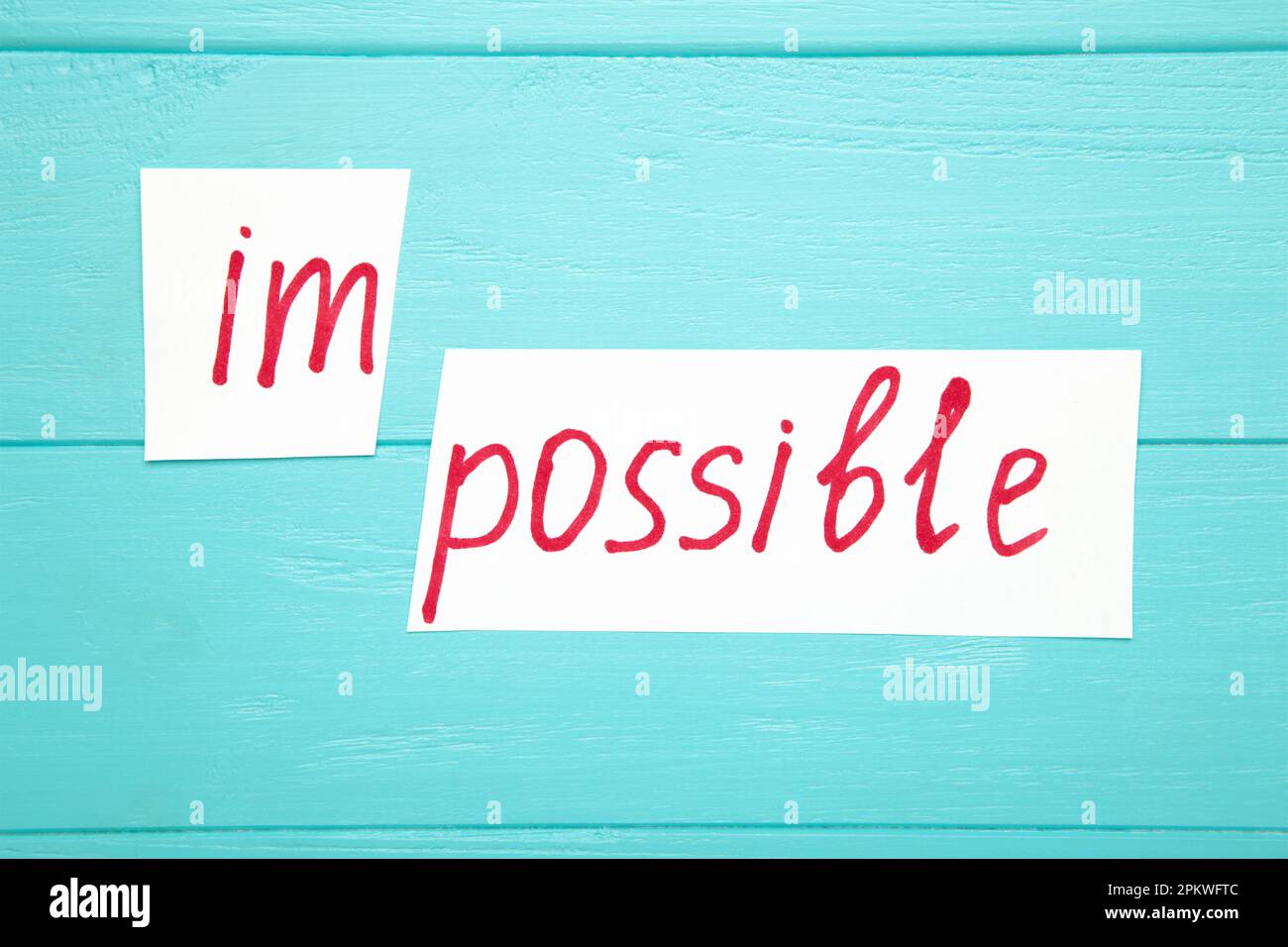 Impossible Is Possible Concept. card with the text impossible, cutting ...