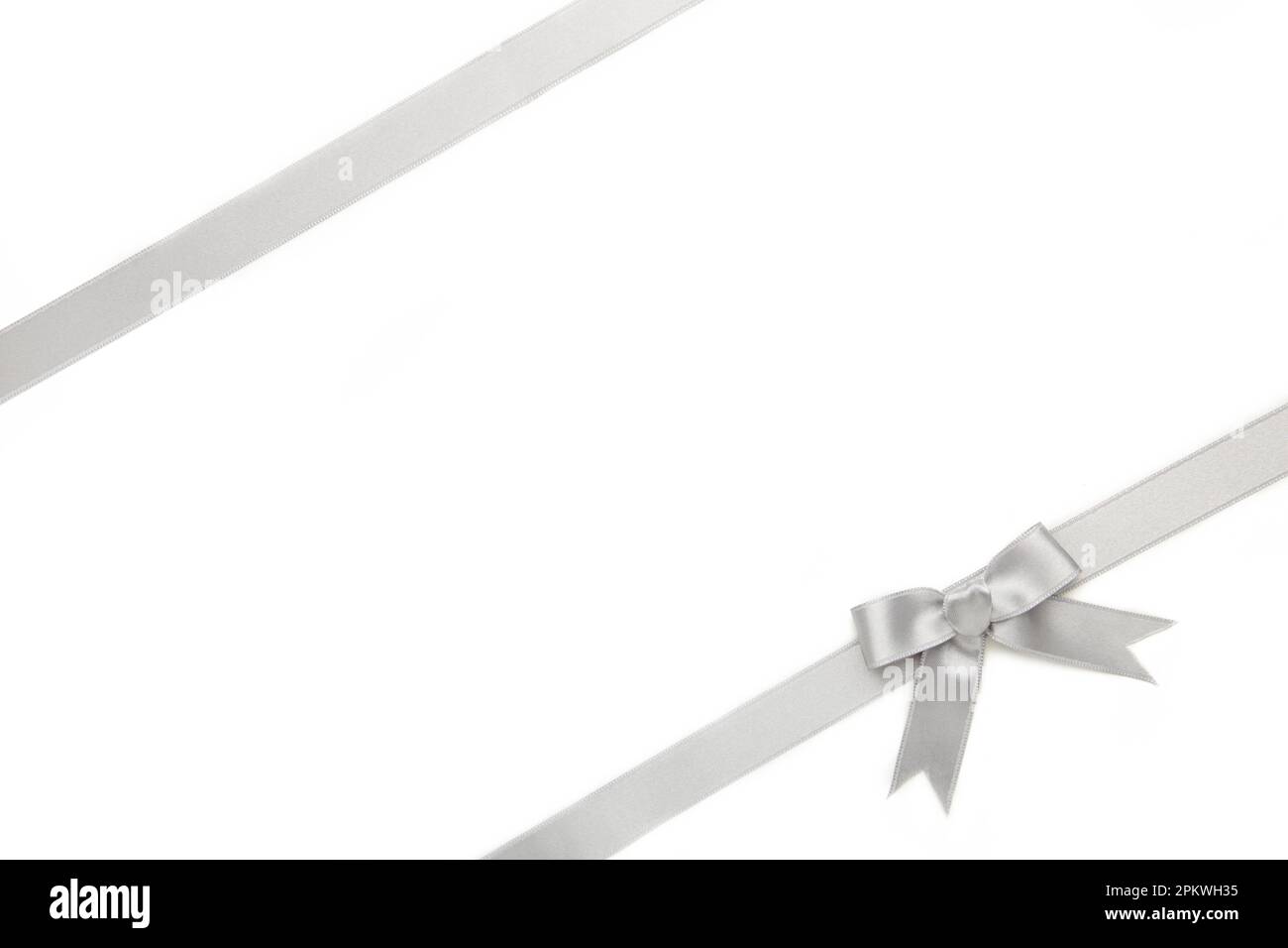 Silver ribbon and bow isolated on white background. Top view Stock ...