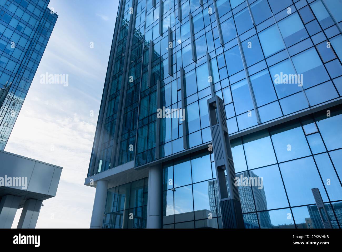 The geometry of modern urban architecture is reflected in the glass ...