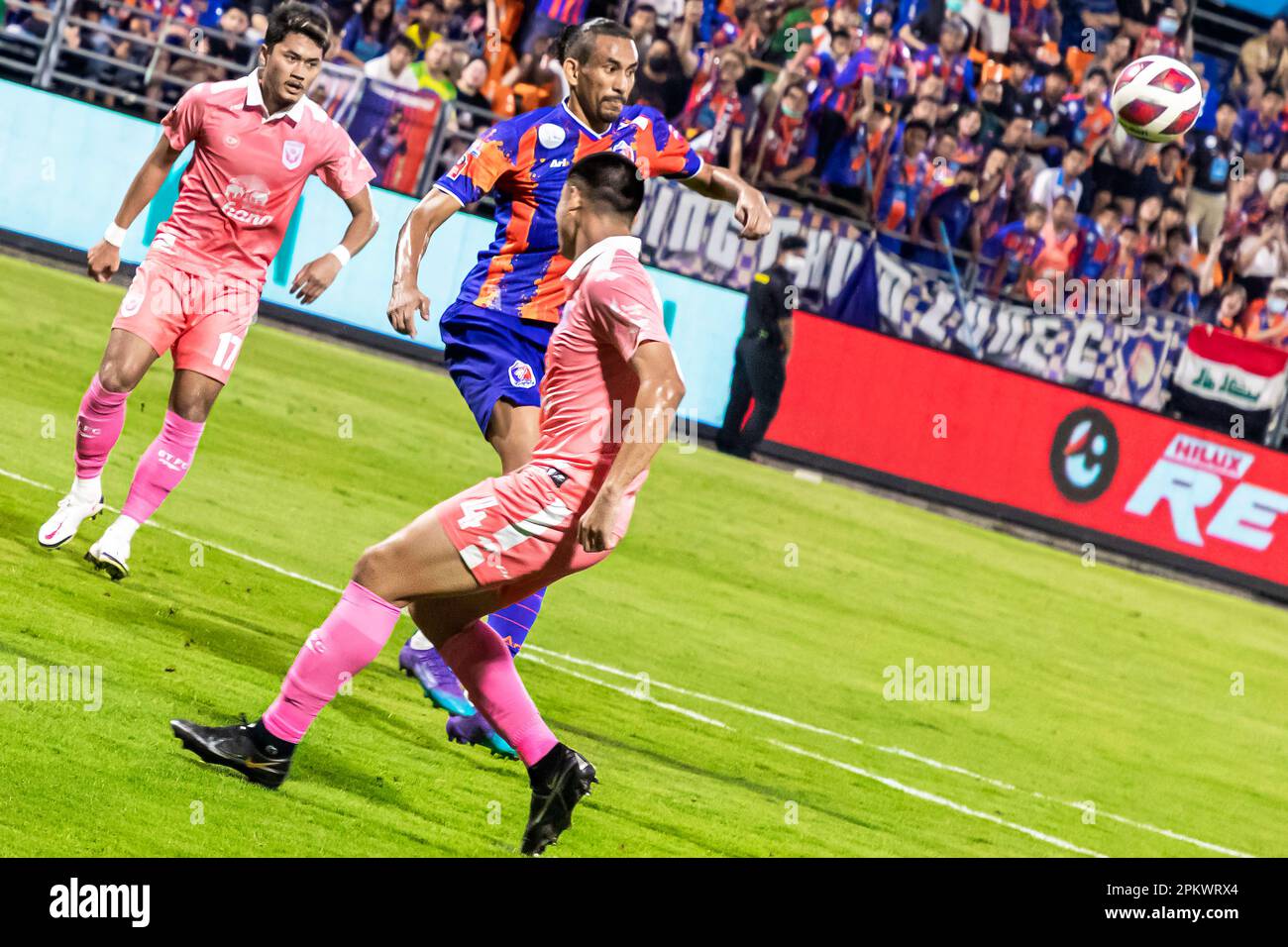Football action during Thai league match at PAT stadium, Klong Toey