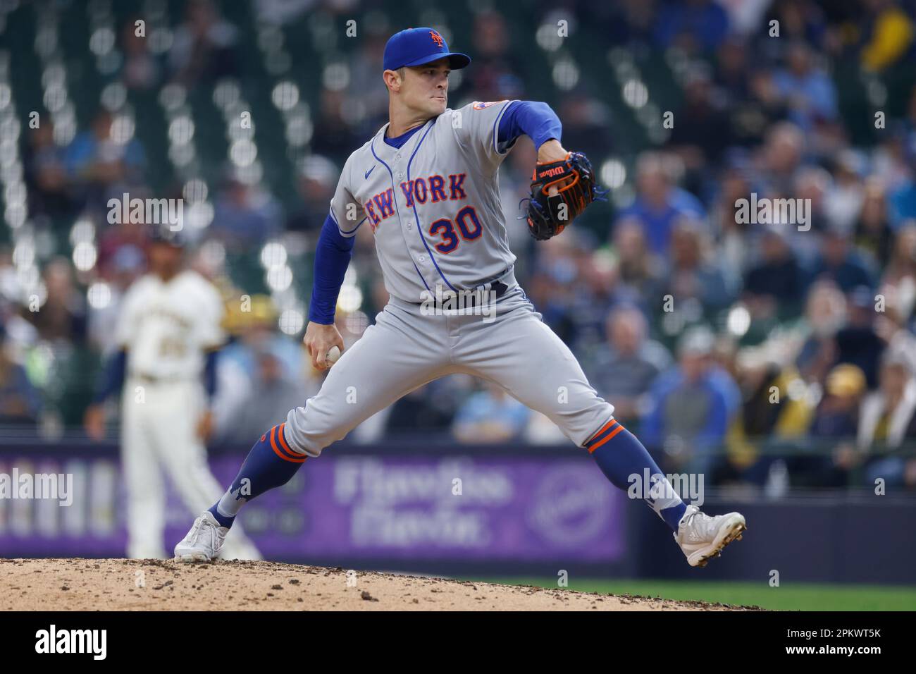 MILWAUKEE, WI - APRIL 05: New York Mets relief pitcher David Robertson (30)  delivers a pitch during an MLB game against the Milwaukee Brewers on April  05, 2023 at American Family Field