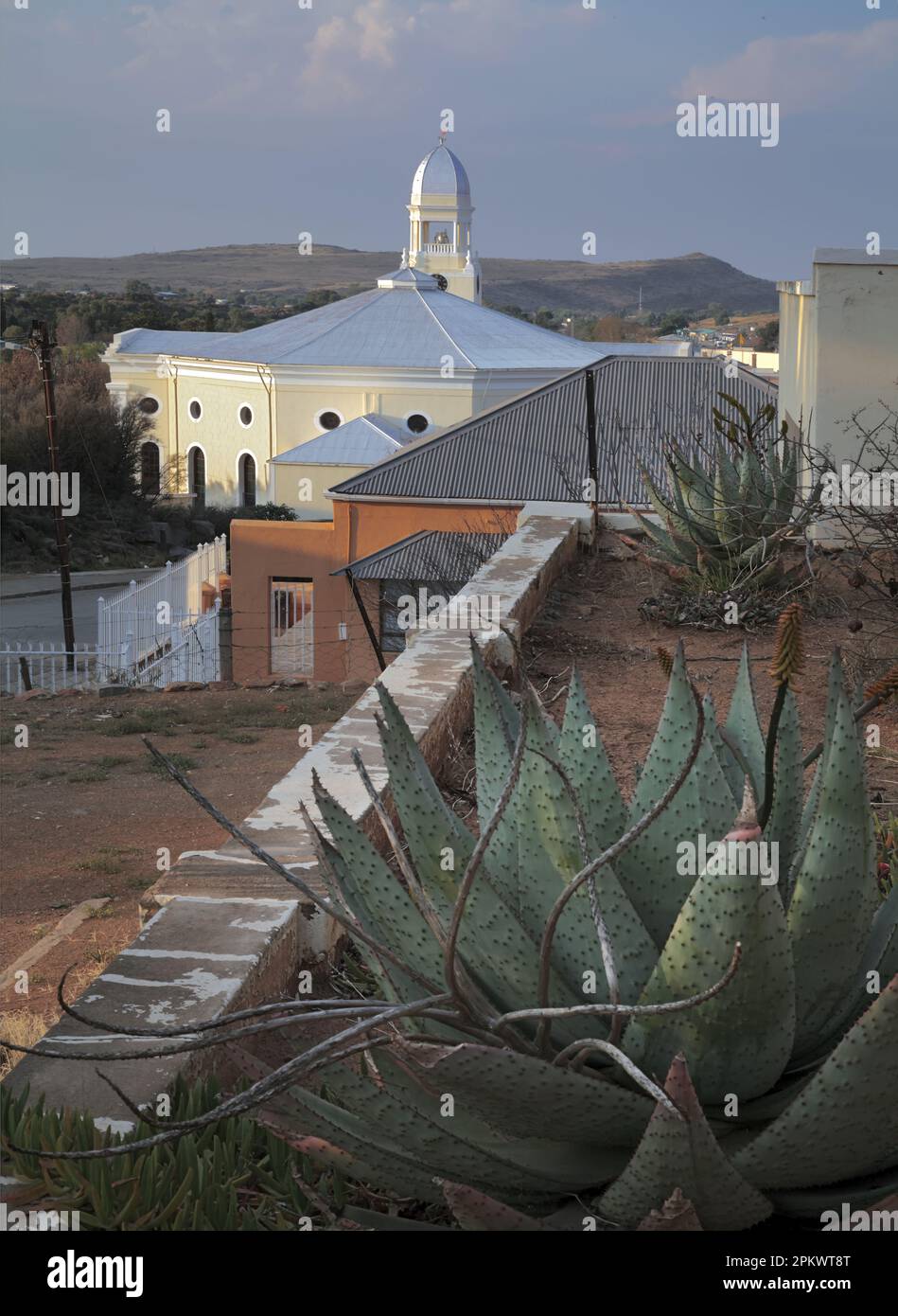 Front garden of house with aloes. Dutch Reformed Church in the Background. Colesburg. Stock Photo