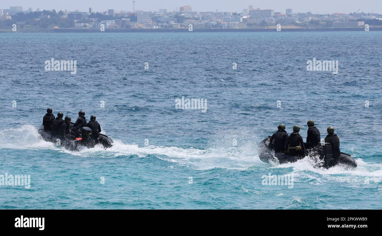 Members of Japan Self-Defense Forces aboard rescue boats search for a ...