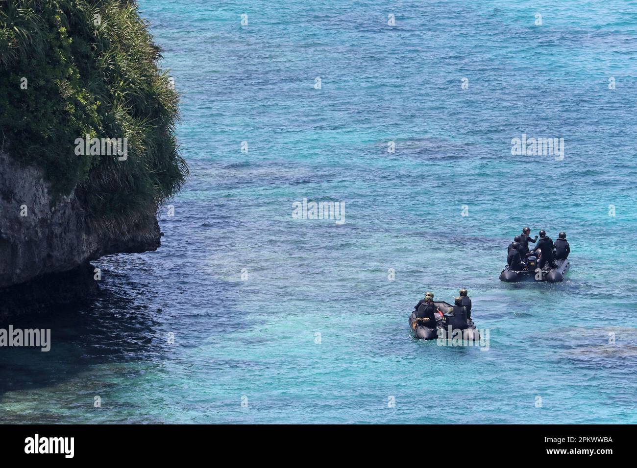 Members of Japan Self-Defense Forces aboard rescue boats search for a ...
