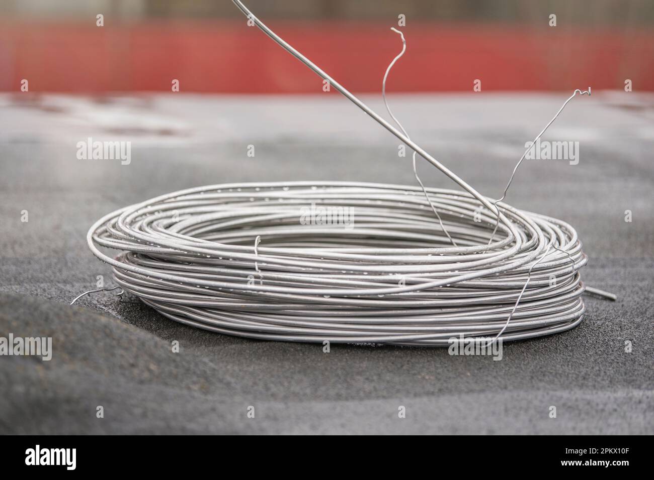 Thick aluminum wire for grounding buildings. Grounding wire to protect the building structure from short circuit. Stock Photo