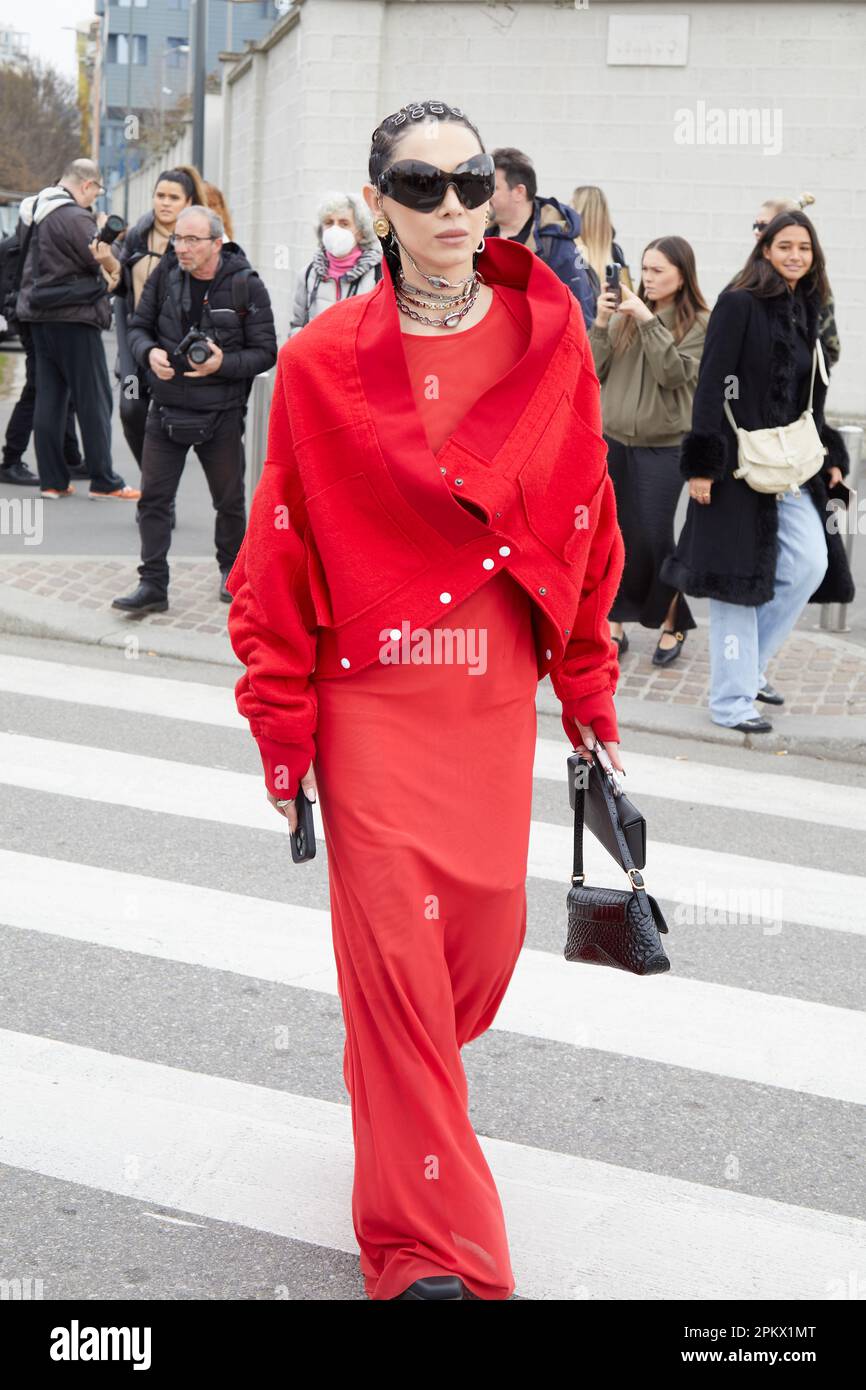 MILAN, ITALY - FEBRUARY 23, 2023: Woman with light pink Prada