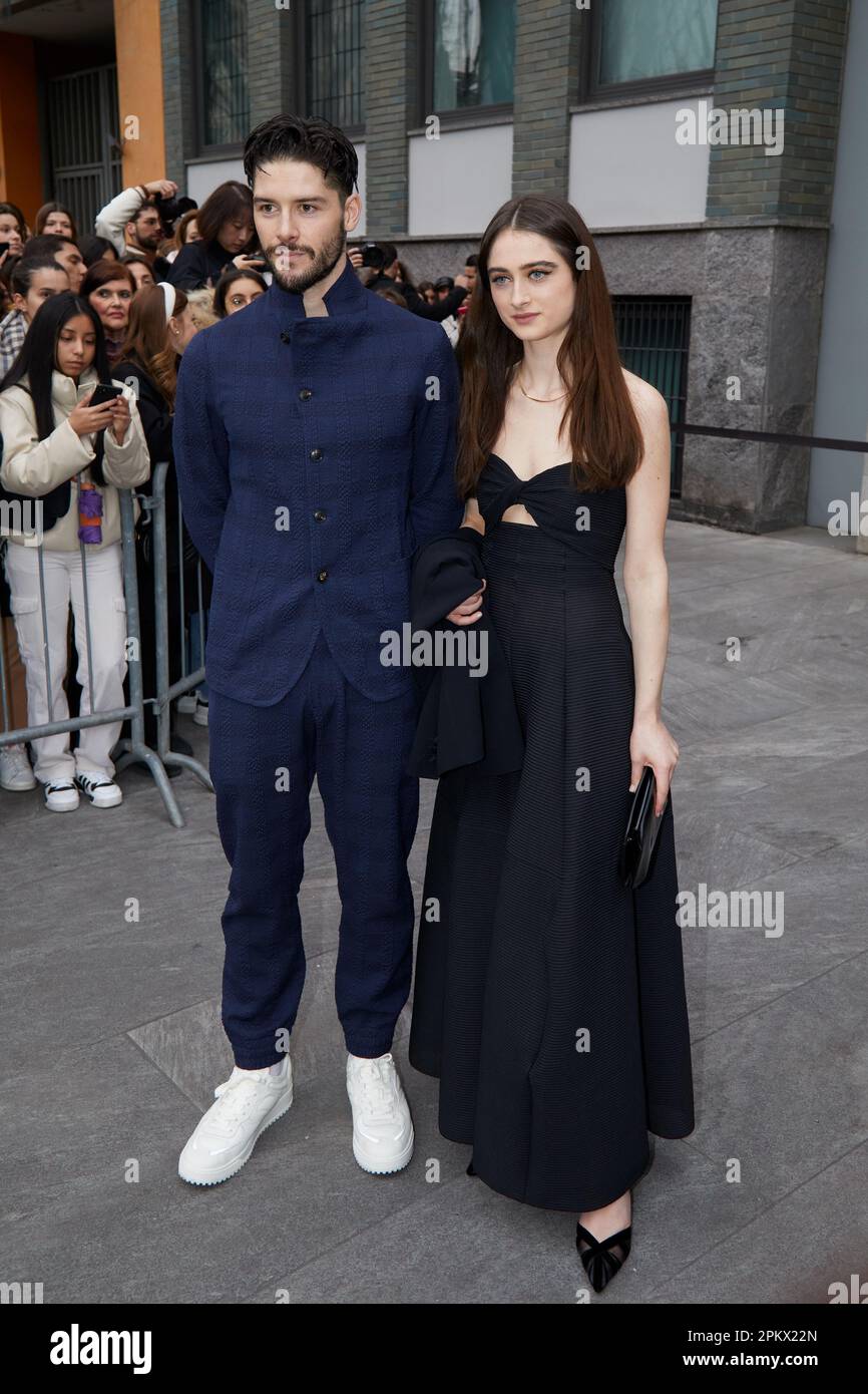 MILAN, ITALY - FEBRUARY 23, 2023: Raffey Cassidy and guest before Emporio Armani fashion show, Milan Fashion Week street style Stock Photo