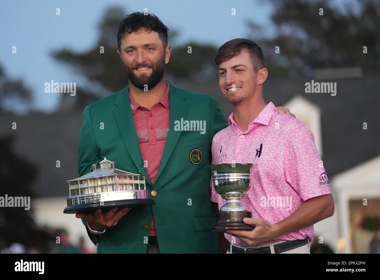 Augusta, USA. 9th Apr, 2023. Jon Rahm (L) of Spain and Sam Bennett of the United States react during the awarding ceremony for the 2023 Masters golf tournament at Augusta National Golf Club, in Augusta, the United States, on April 9, 2023. Credit: Wu Xiaoling/Xinhua/Alamy Live News Stock Photo