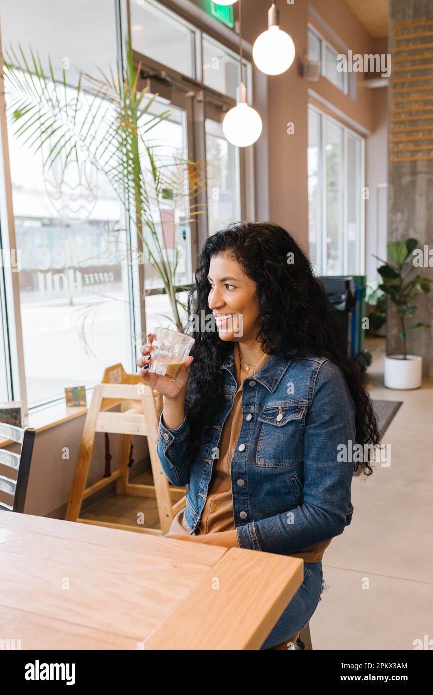 Happy latina woman hi-res stock photography and images - Alamy