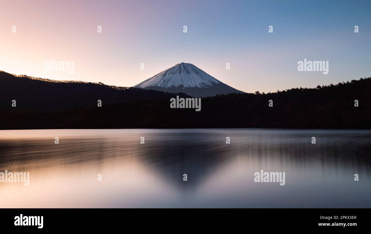 Mount Fuji at sunrise from lake Saiko, Yamanashi Prefecture, Japan Stock Photo