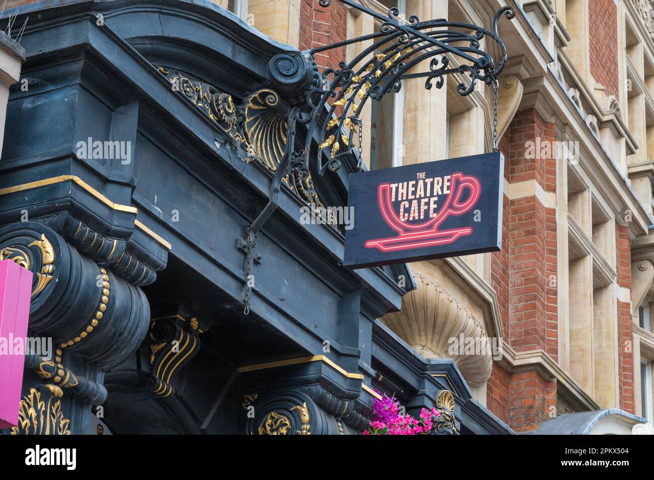 Neon sign above the elaborate entrance to the Theatre Cafe, a theatre