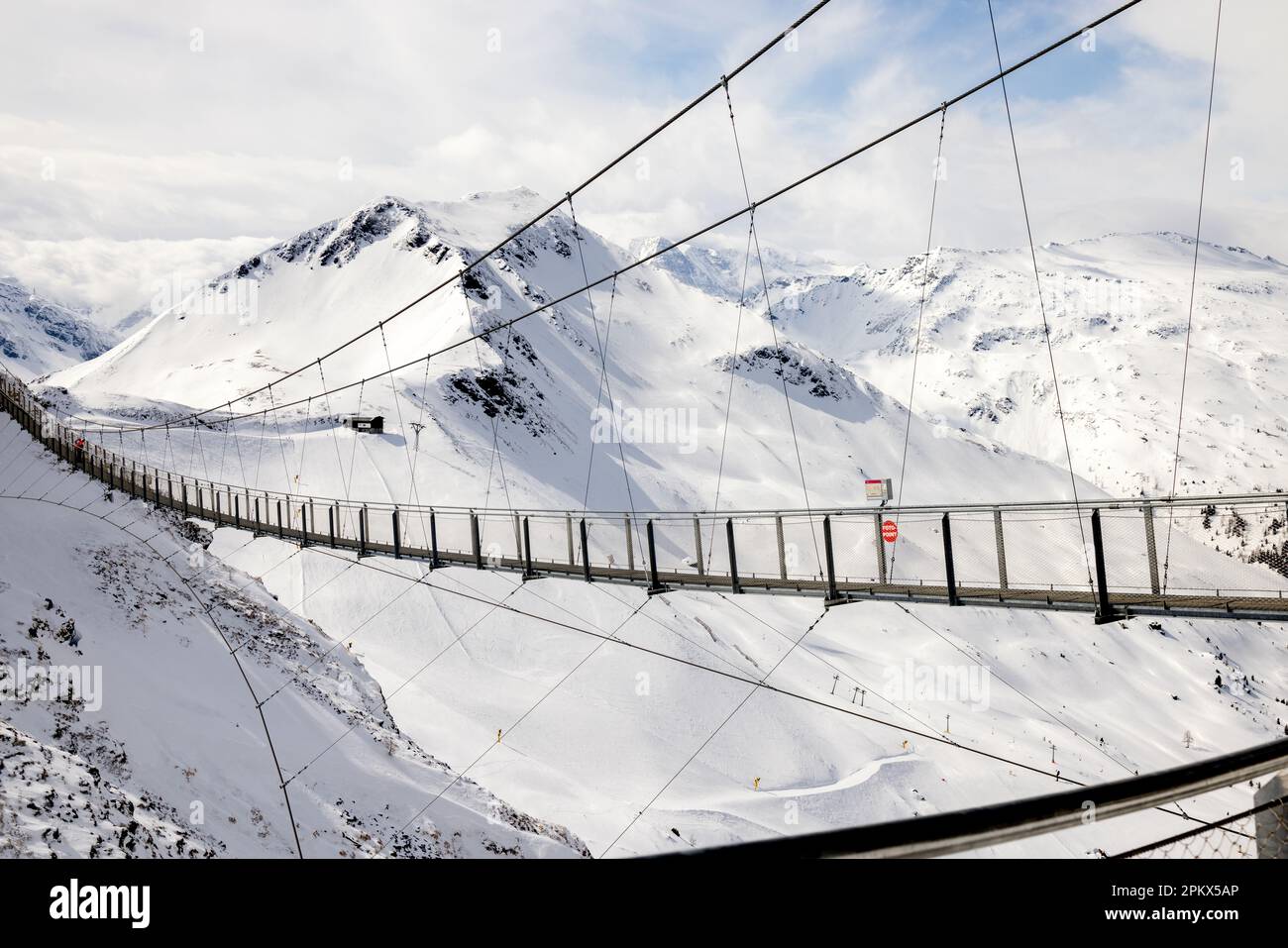 Suspension bridge in the Alpine Mountains Stock Photo - Alamy