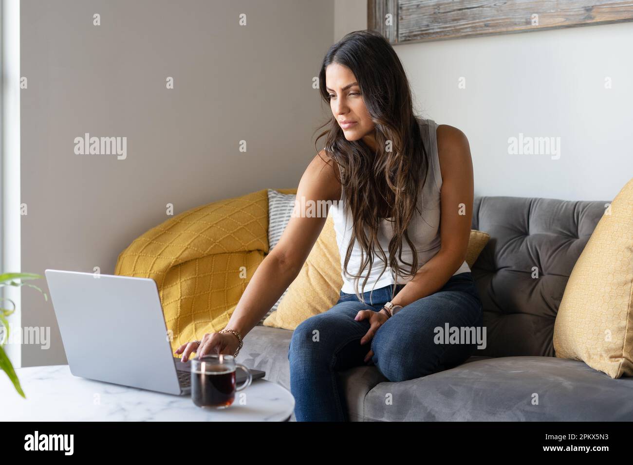 Woman working From Home On The Sofa Stock Photo