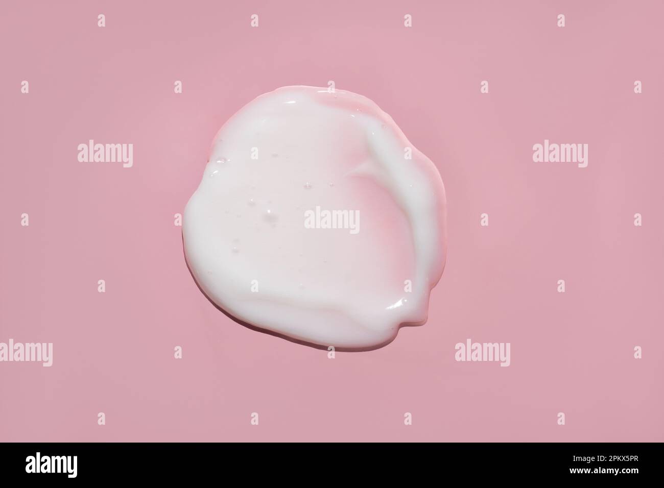 white opaque cream with bubbles lotion moisturizer smudge swatch