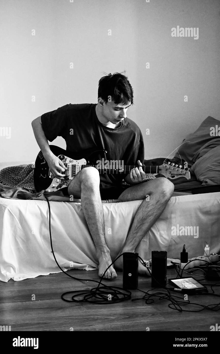 Black'n white photo of the guy who plays electric guitar Stock Photo