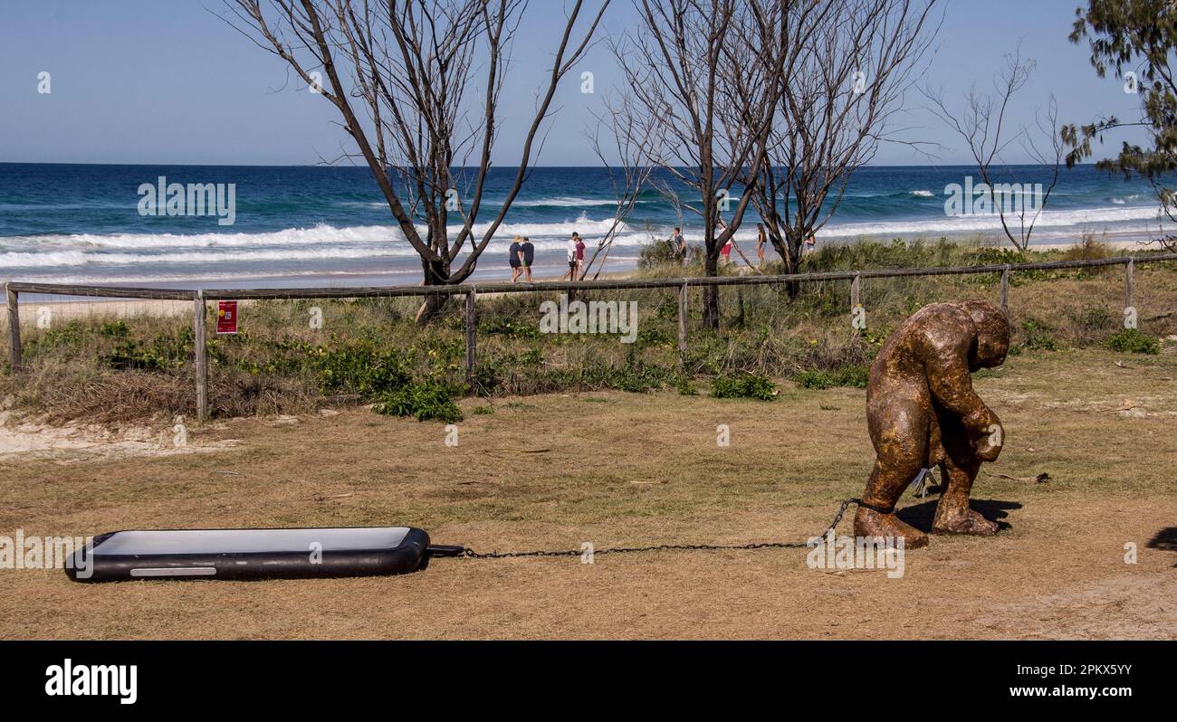 Exhibit at Swell Sculpture Festival, Device Tethering by David McGuinness, 2014. Gold Coast, Australia. Man ruled by mobile/cell phone. Stock Photo