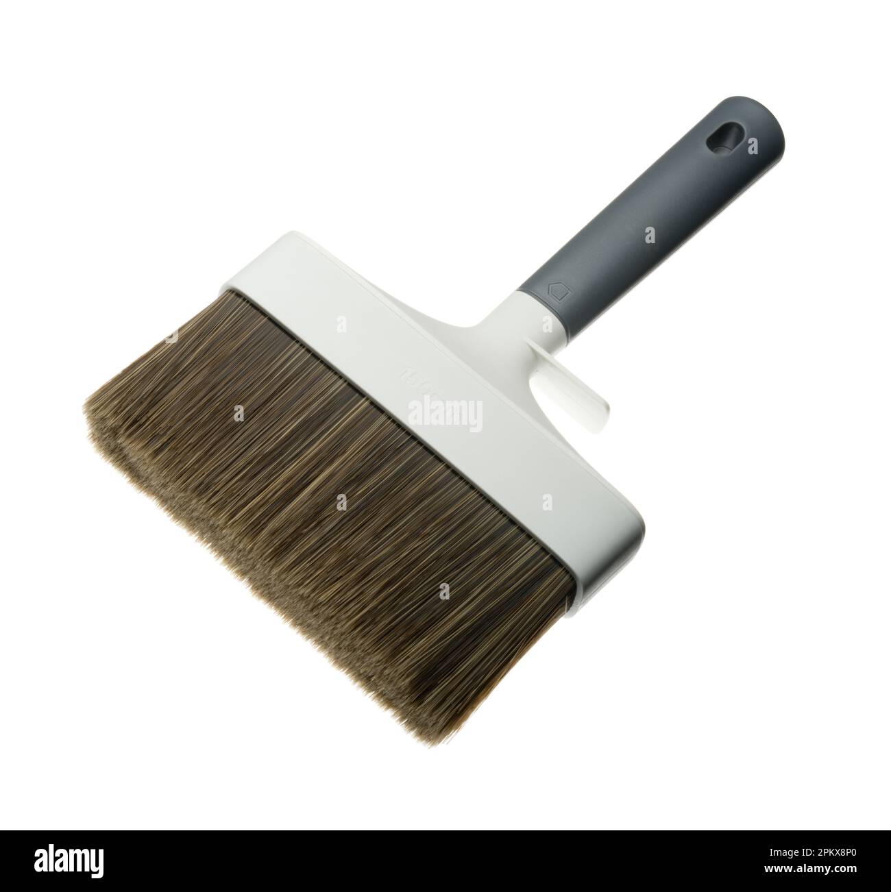 A large exterior wall paint brush. 150mm wide paintbrush for painting expansive surfaces such as house exterior brickwork. Stock Photo