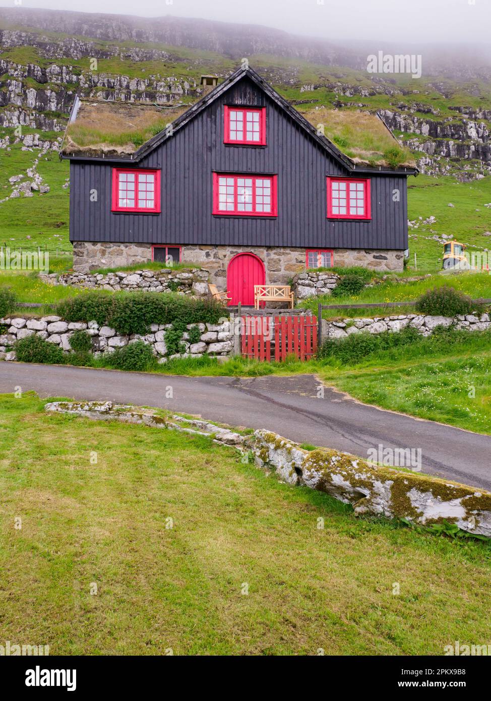 Kirkjubour, Faroe Islands July 2021 Typical wooden Faroese house with red windows. Northern