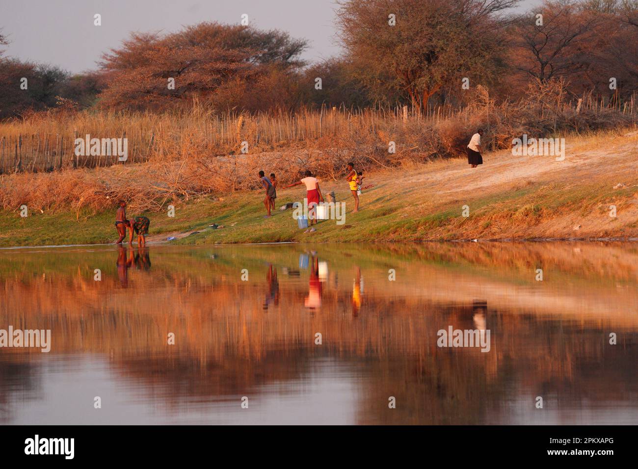 People fetching water from the Zambezi River Stock Photo