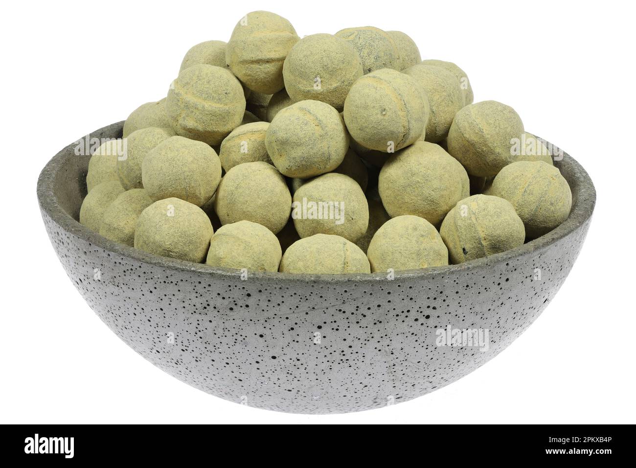 salmiak hagel candies in a concrete bowl isolated on white background Stock Photo