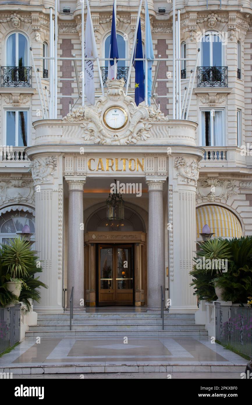 The entrance to the Ritz Carlton Hotel in Cannes on La Croisette, with Rolex clock above the doorway. Stock Photo