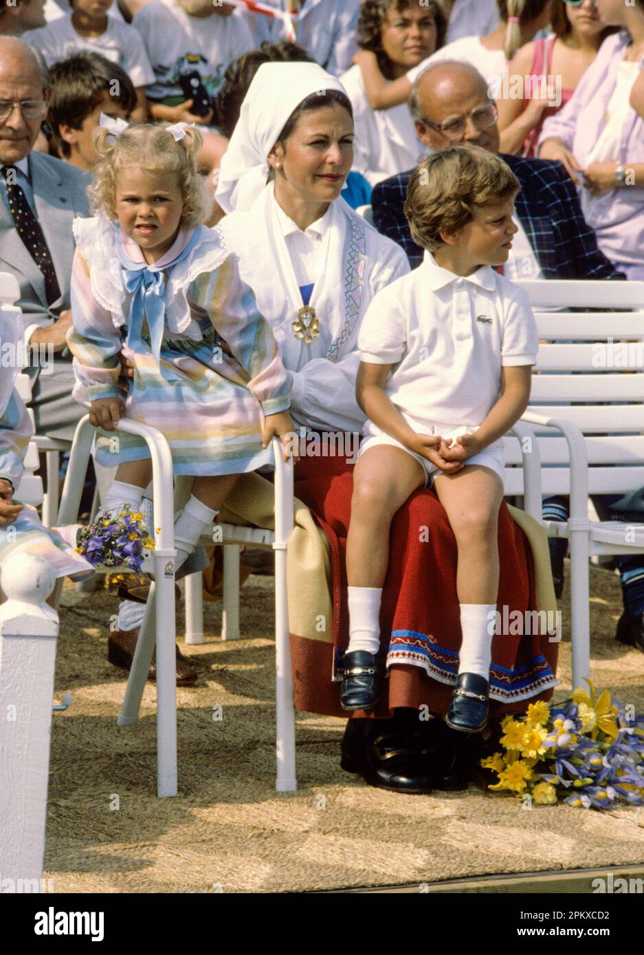 QUEEN SILVIA OF SWEDEN with Madeleine and Cral Philip on her lap during Crown Princess Victoria´s birthday at Solliden Stock Photo