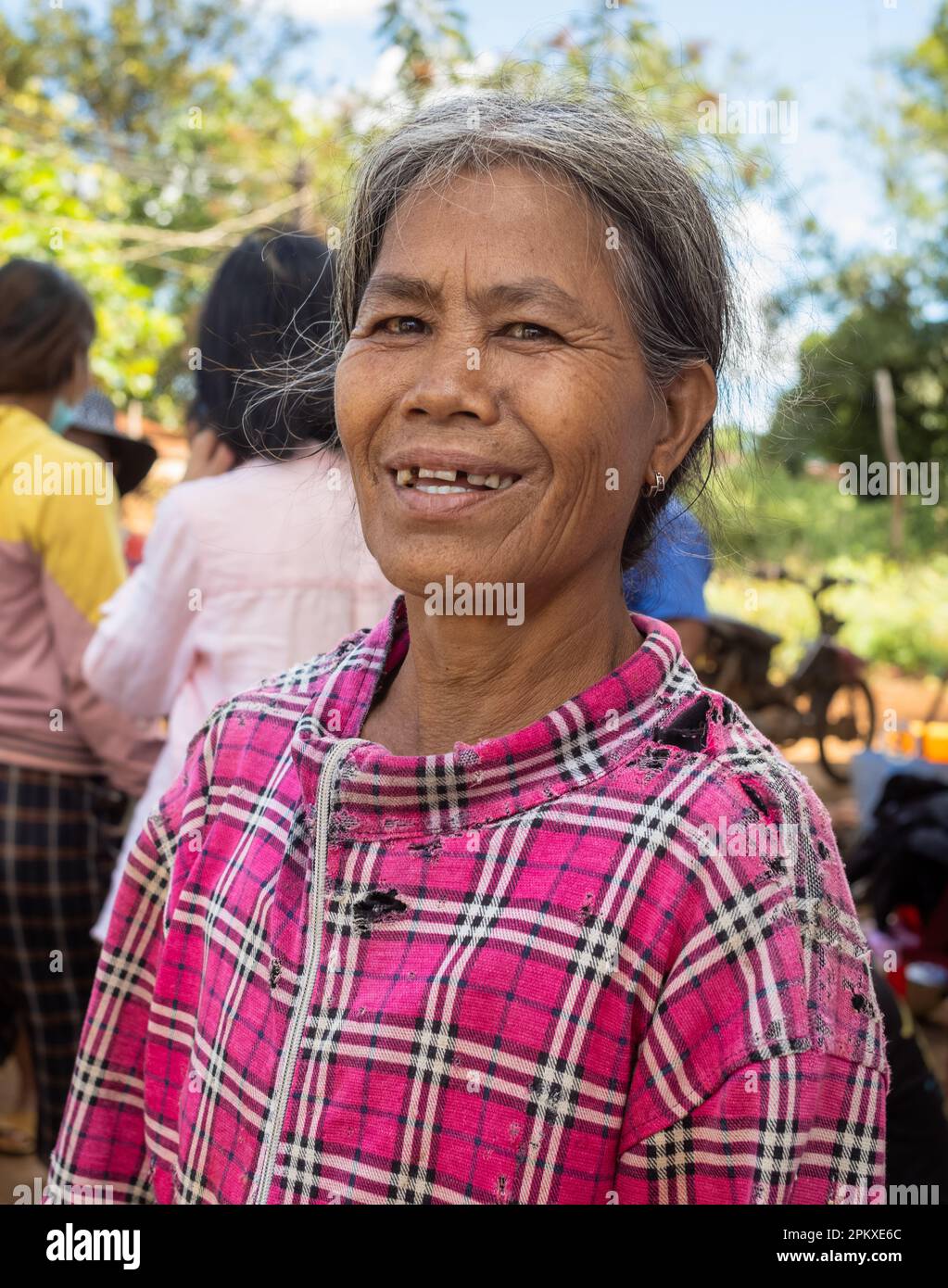 A middle-aged woman from the Jerai ethnic minority in her village in Gia Lai province in the central highlands of Vietnam. Stock Photo