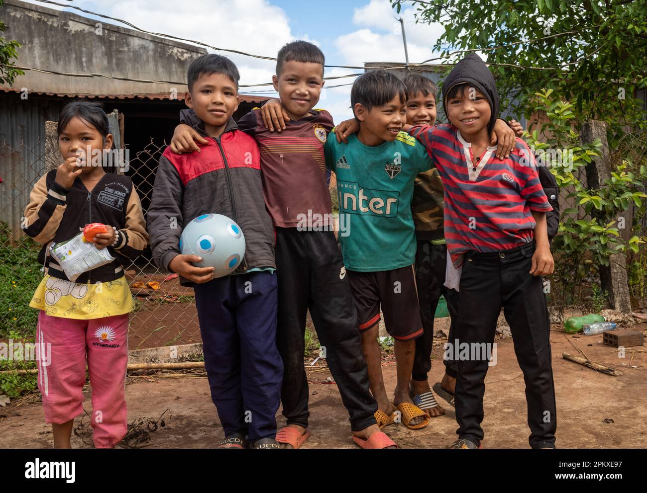 A group of Jerai ethnic minority children with a football in Gia Lai ...