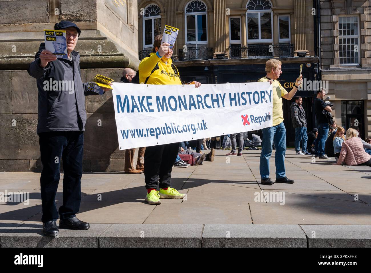 Demonstrators hold a sign saying 'Make Monarchy History' in Newcastle upon Tyne, ahead of the King's Coronation in the UK. Stock Photo