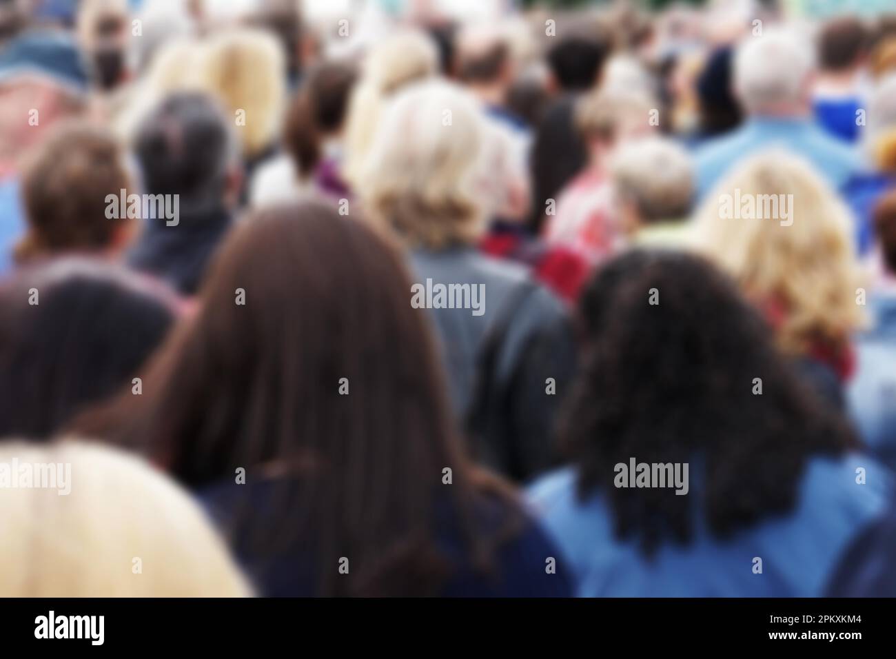 blurred rear view of anonymous crowd of people Stock Photo