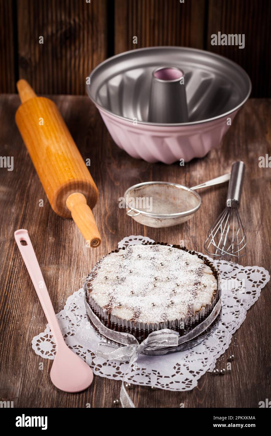 Homemade Christmas cake with baking utensils Stock Photo Alamy