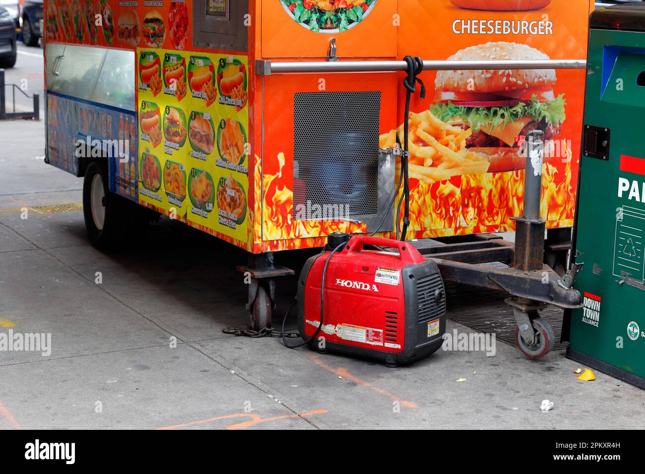 A Honda portable gas generator attached to a mobile food vendor cart in Lower Manhattan. Stock Photo
