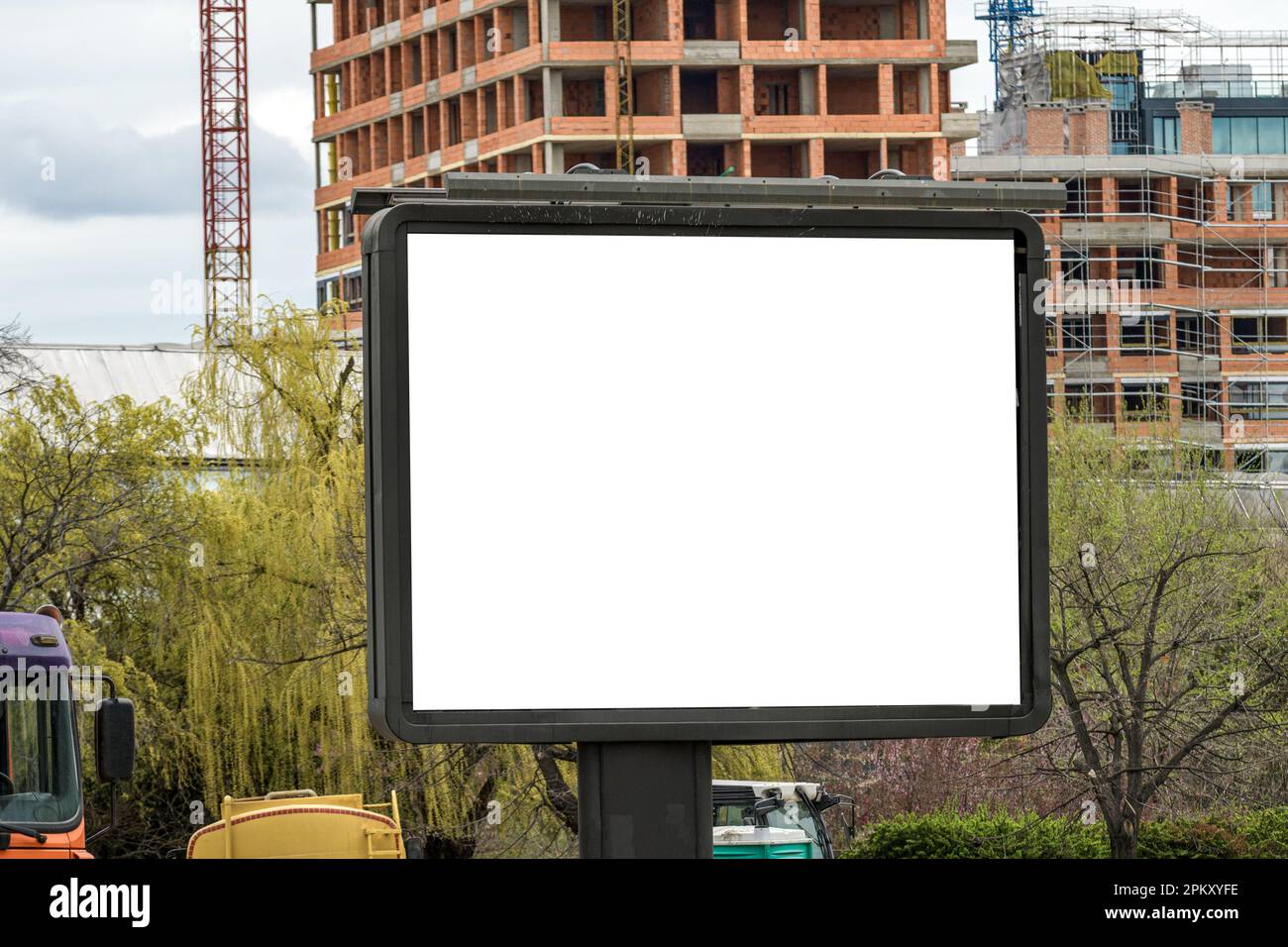 Outdoor advertising billboard mockup on building construction site