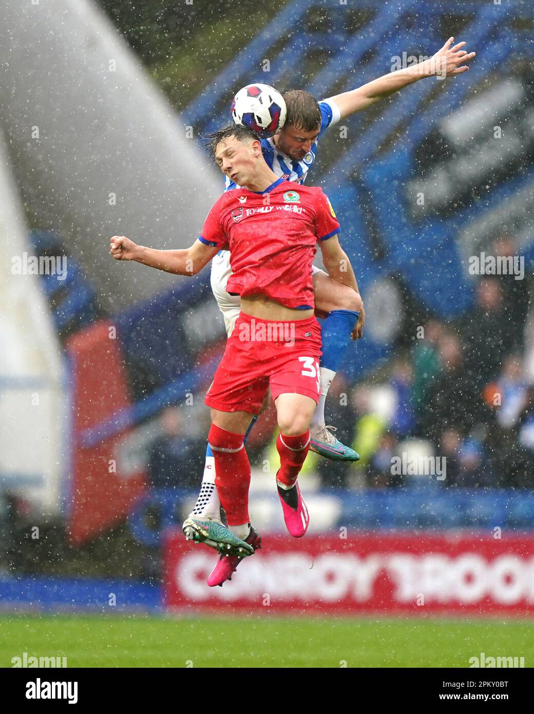 Blackburn Rovers' Harry Leonard and Huddersfield Town's Michal Helik battle for the ball during the Sky Bet Championship at the John Smith's Stadium, Huddersfield. Picture date: Monday April 10, 2023. Stock Photo
