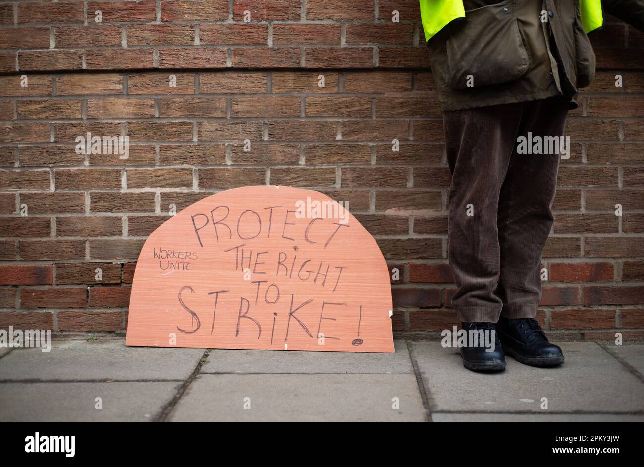 A Protect the Right to Strike banner an PCS trade union official picket line outside York Job centre in York, North Yorkshire as workers go on strike Stock Photo