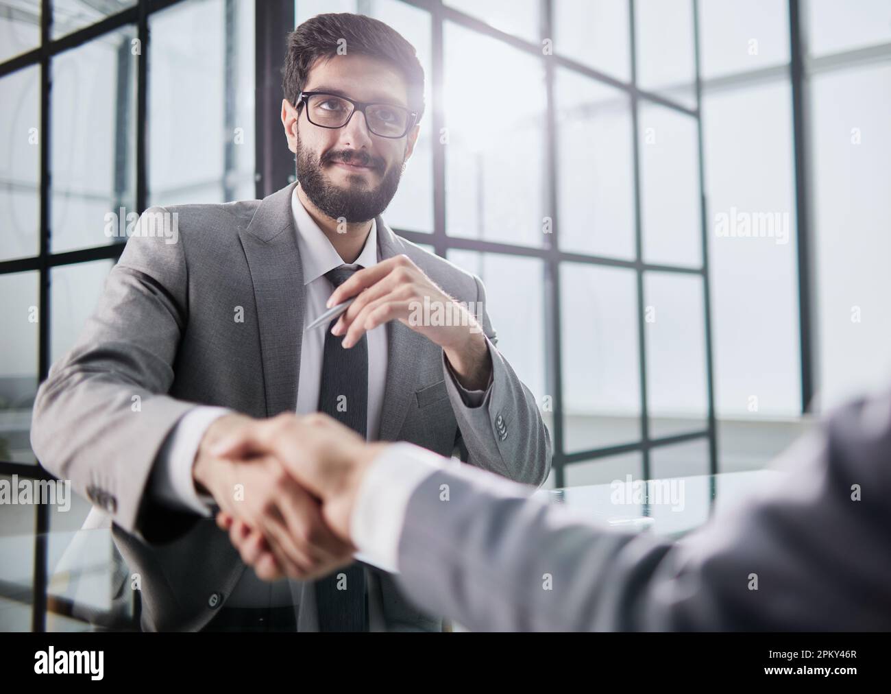 Software Handshaking Handshake of two businessmen who enters into the contract to develop a ...