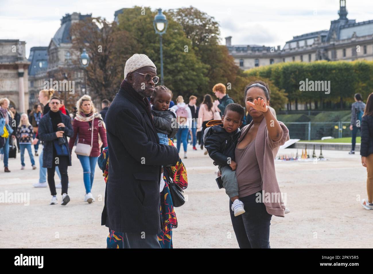 African Family of Grandfather, Grandmother, Mother, and Two Toddlers Enjoying a Beautiful Park in Paris Stock Photo