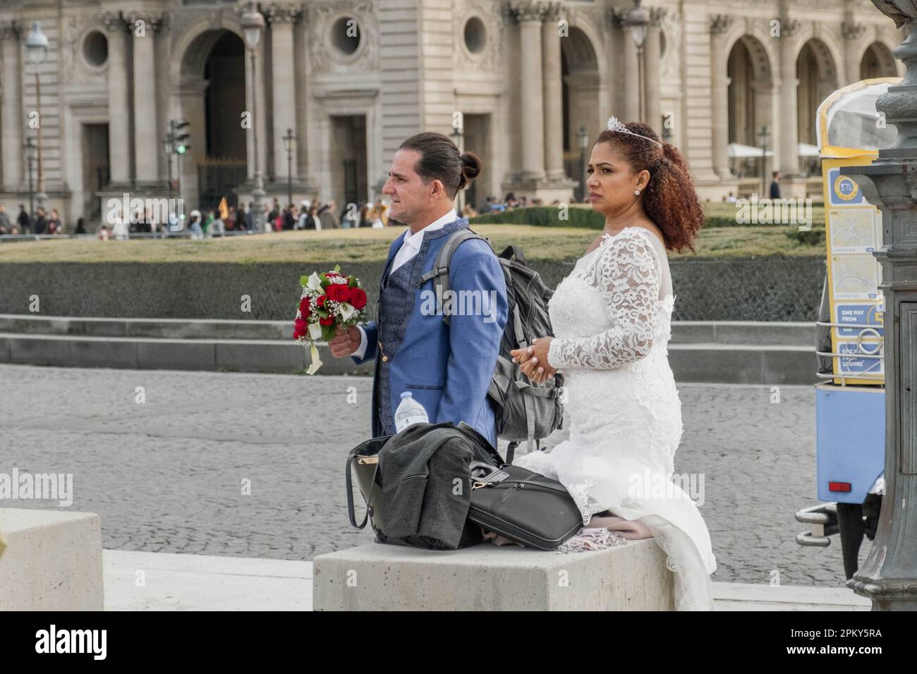 Celebrating Love in the City of Romance: A Beautiful Couple Embracing their Special Day in Paris Stock Photo