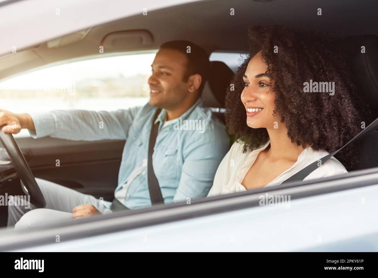 Happy Middle Eastern Car Owners Couple Enjoying Ride In Auto Stock