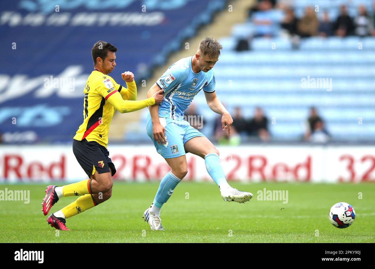 Coventry City's Callum Doyle (right) and Watford's Henrique Araujo battle for the ball during the Sky Bet Championship at the Coventry Building Society Arena, Coventry. Picture date: Monday April 10, 2023. Stock Photo