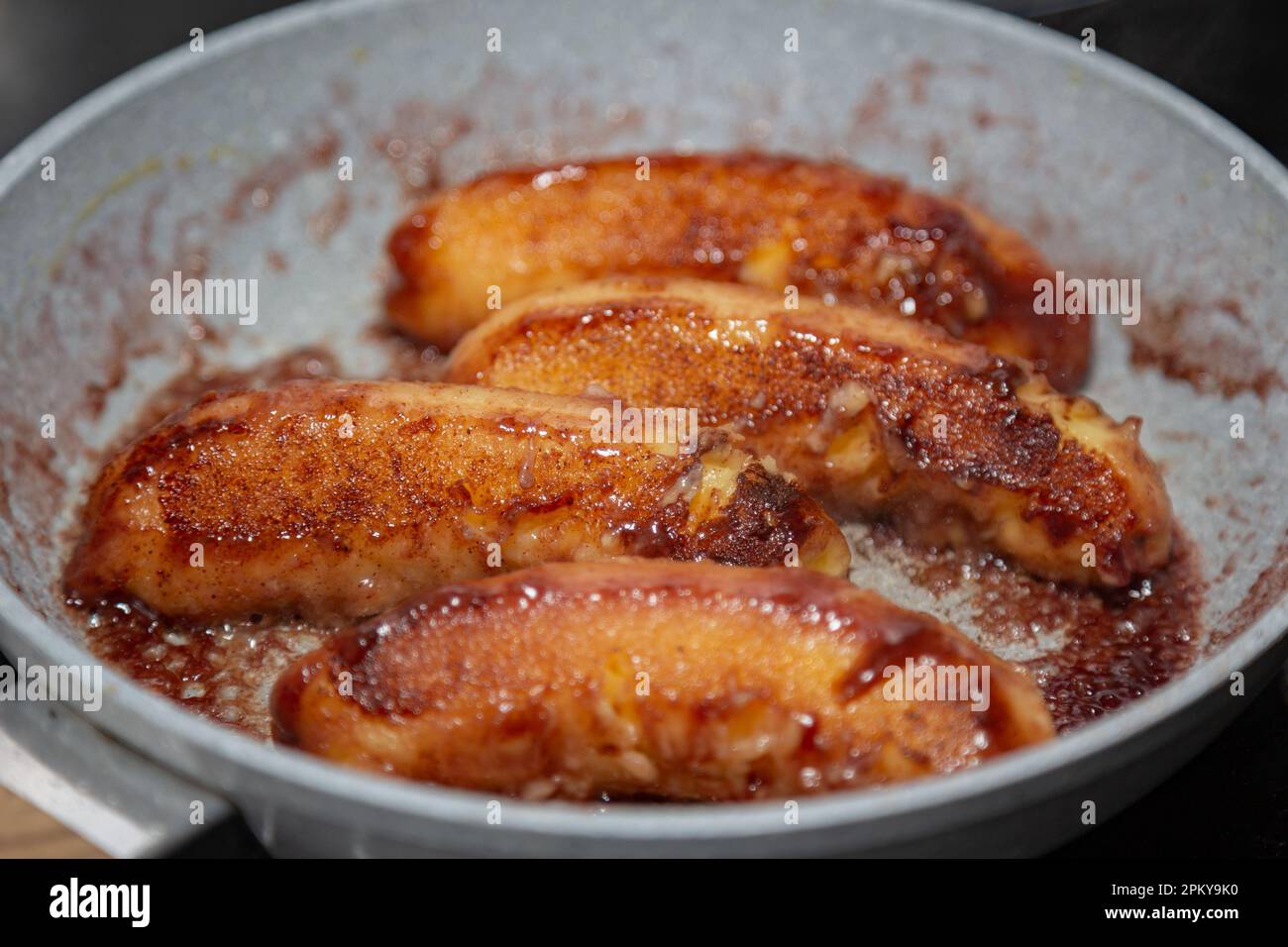 Traditional banana flambe in butter and cinnamon Stock Photo Alamy