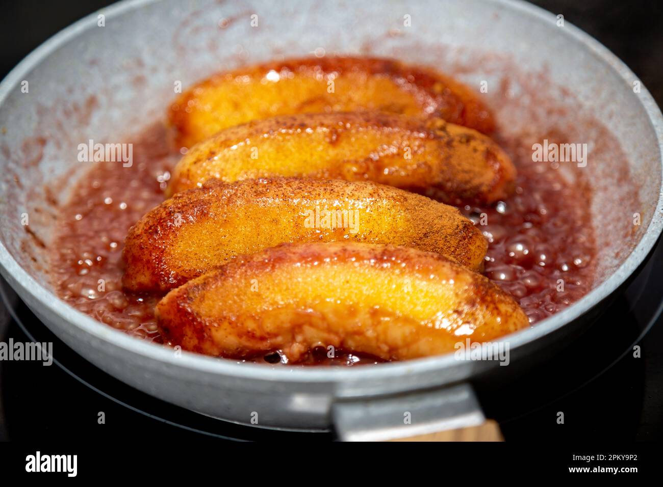 Traditional banana flambe in butter and cinnamon Stock Photo Alamy