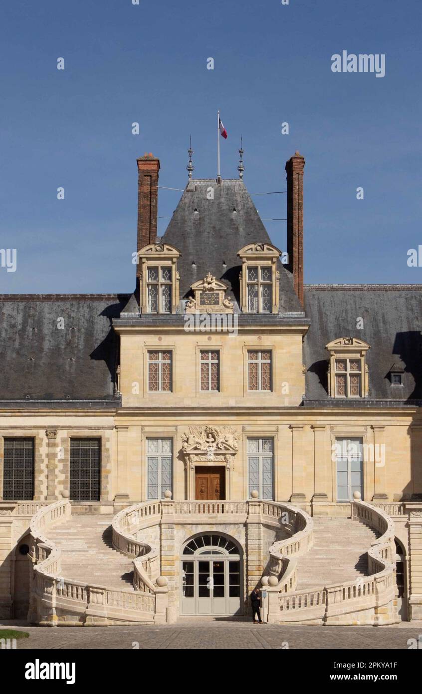 Fontainebleau Palace's famous Horseshoe staircase on the main facade, photographed in spring 2023 after a three-year renovation project Stock Photo