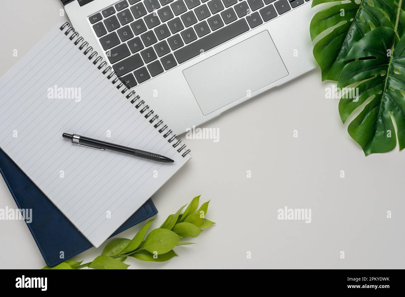 Empty notepad and modern smart phone mockup on white office desk surrounded  with office supplies. Top view. Flat lay Stock Photo - Alamy