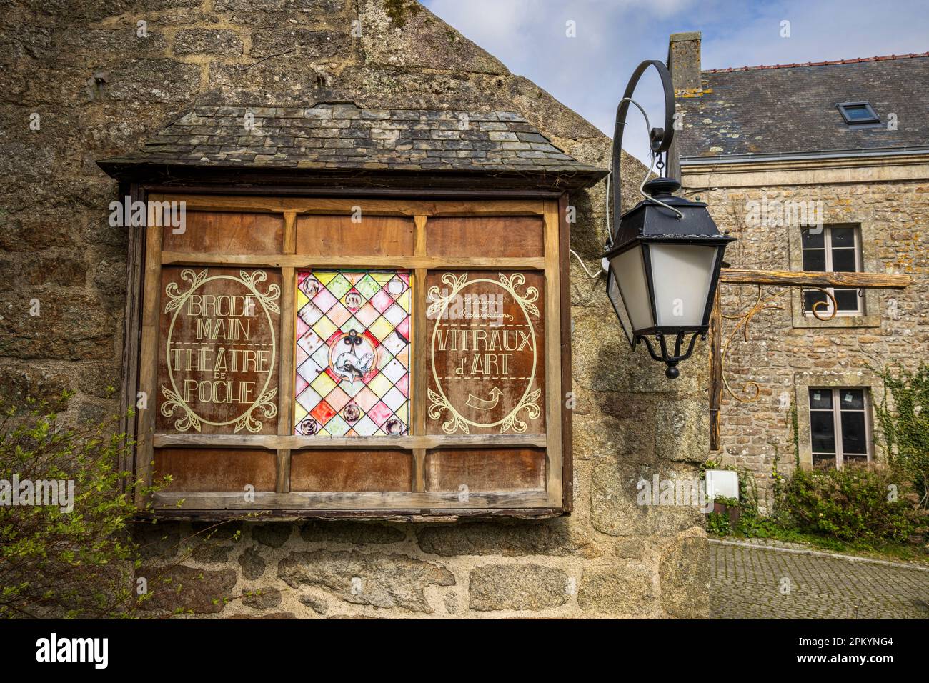 A Shop Sign In The Streets Of Locronan Brittany France Stock Photo a-shop-sign-in-the-streets-of-locronan-brittany-france-stock-photo
